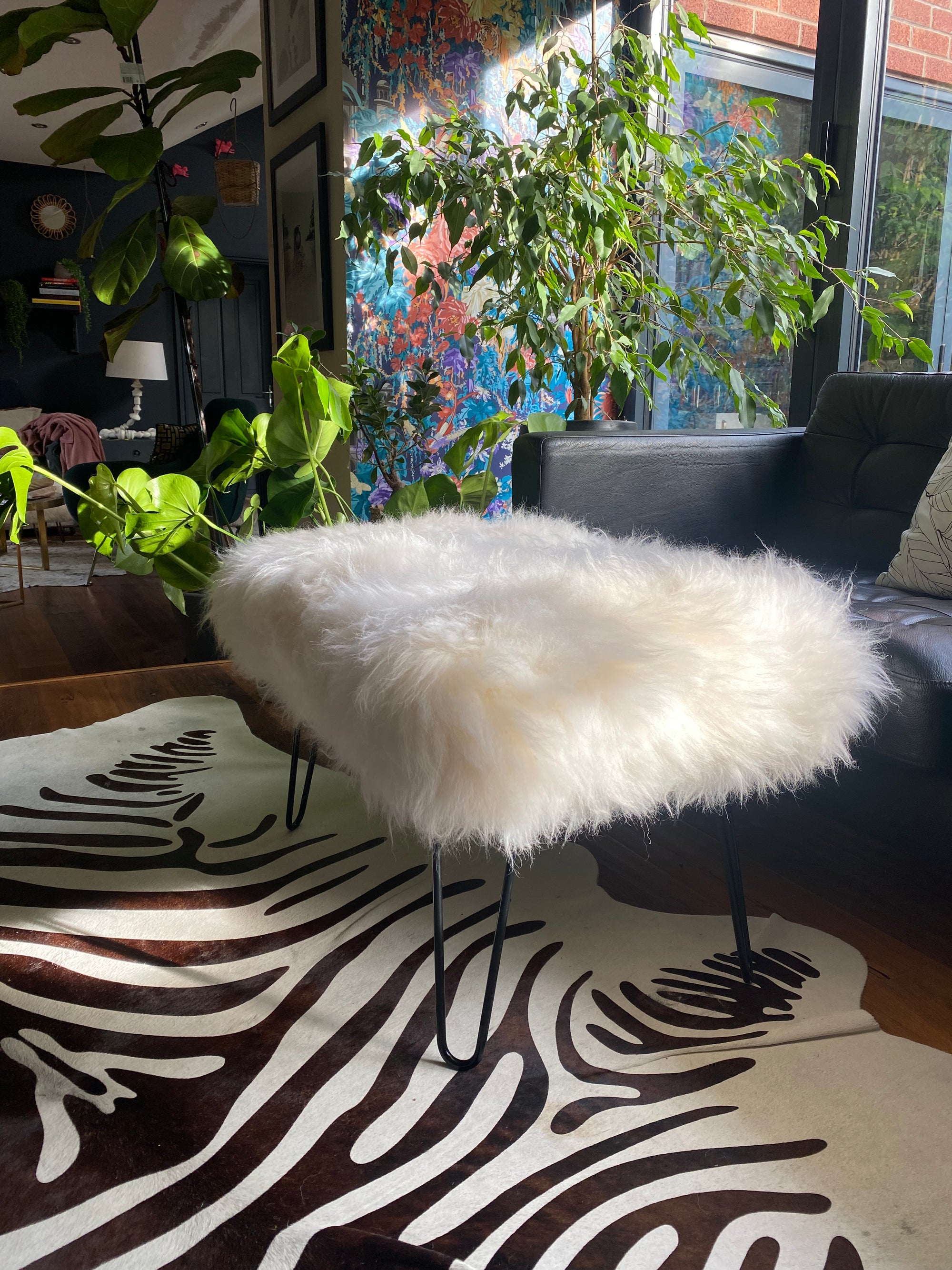 sheepskin upholstered footstool with hairpin legs