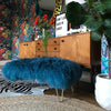 Teal turquoise mongolian sheepskin upholstered footstool with gold hairpin legs