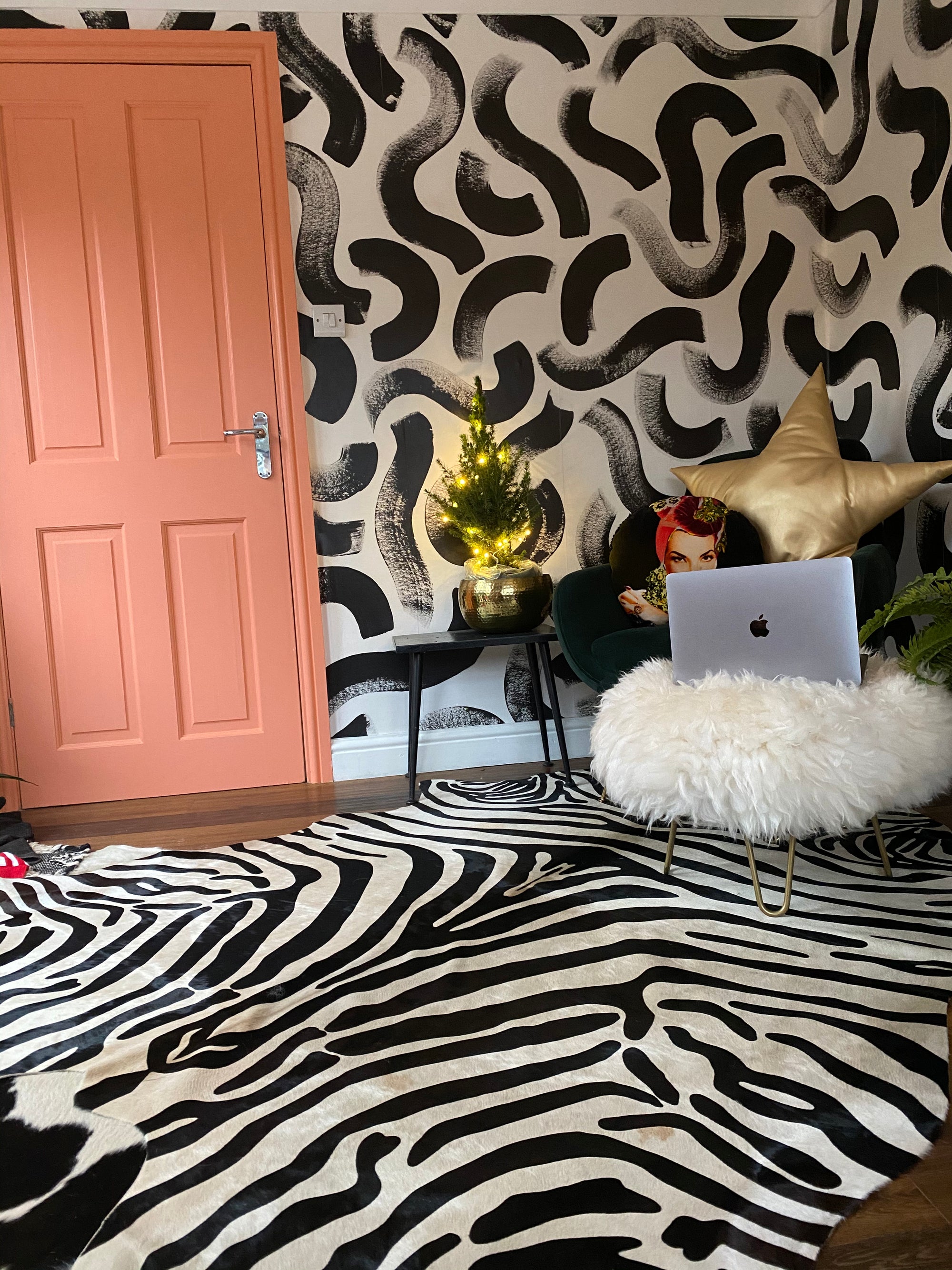 large sheepskin round footstool pouffe with gold metallic hairpin legs