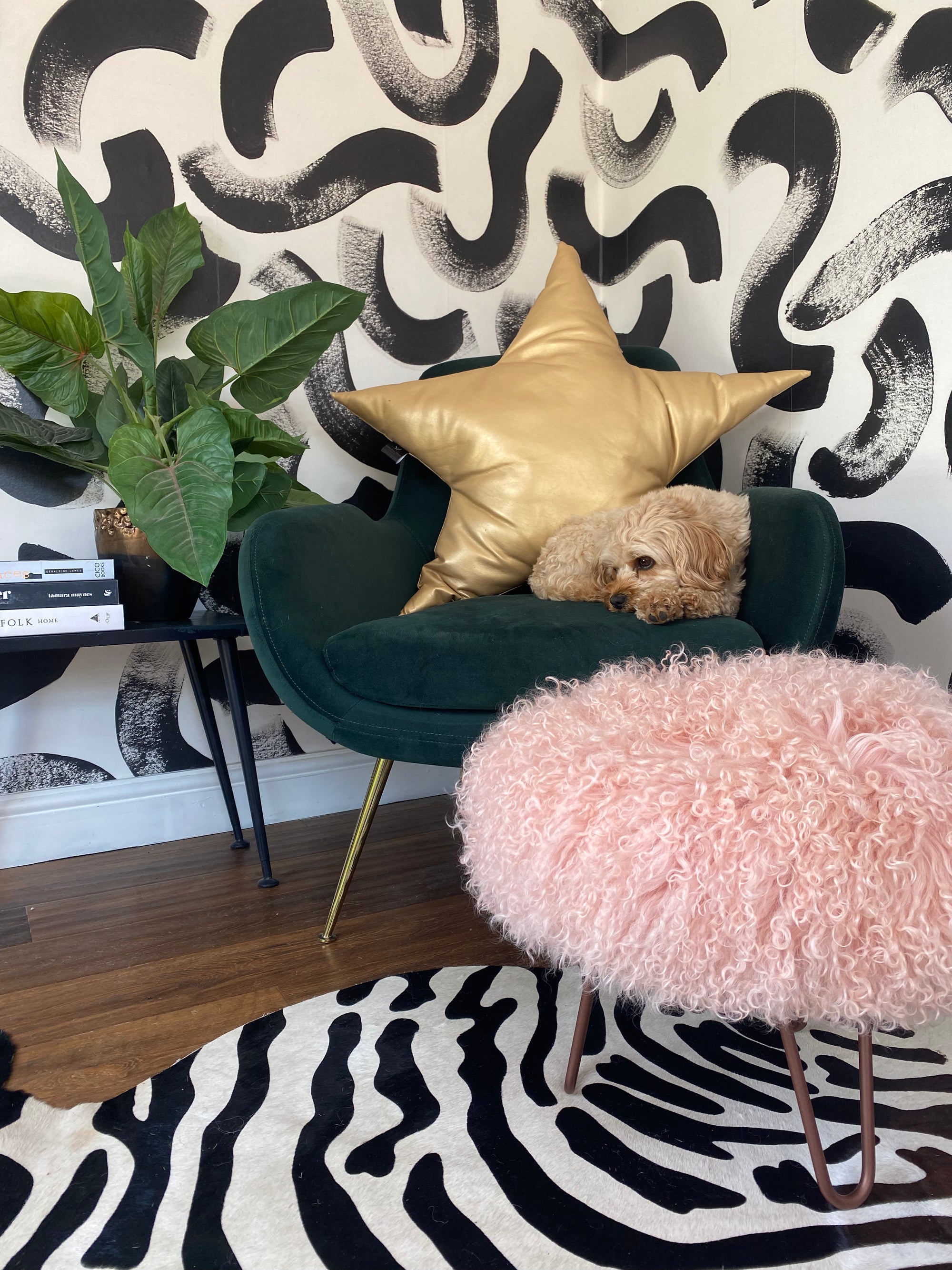 Small round Mongolian Sheepskin upholstered footstool with hairpin legs