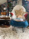 small mongolian footstool in teal