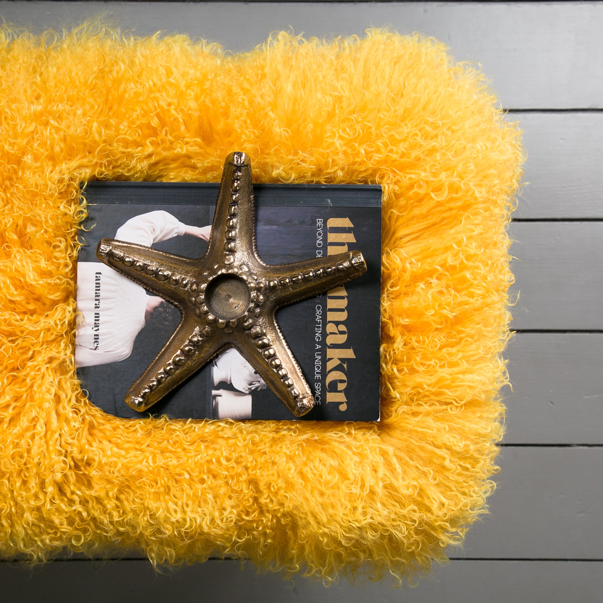 mustard mongolian sheepskin bench with hairpin legs