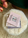 small round sheepskin footstool pouffe with hairpin legs